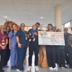 Zara and James Durham cheque presentation with Oakley